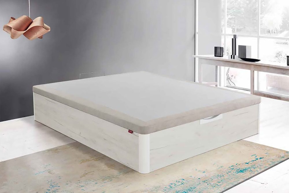 Un Canapé modelo Forte moderno con cajón de almacenamiento en un dormitorio minimalista.