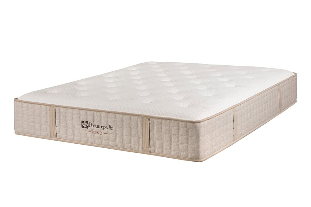 Un colchón Colchón Seally Iowa Ultra beige con la parte superior acolchada y los laterales texturizados, expuesto sobre un fondo blanco.