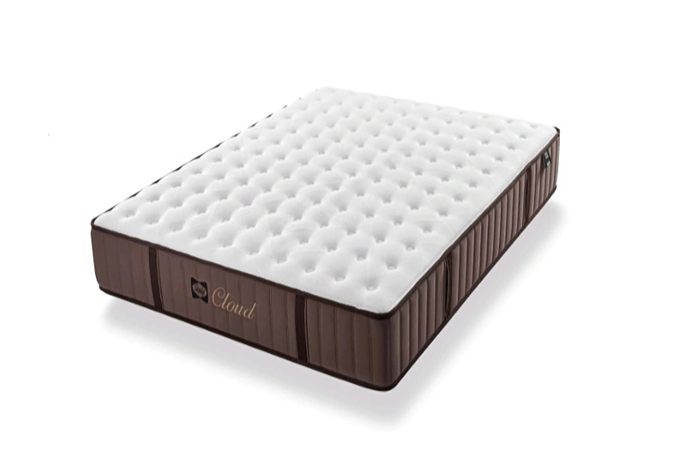 La Nube Colchón Seally presenta una forma rectangular con la parte superior blanca y empenachada y los laterales marrones, sobre un fondo blanco liso.